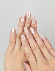Hand model wearing Naillover Tender Shine cat eye Singapore press on nails with pearlescent finish