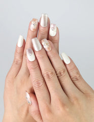 Hand wearing Twilight Singapore press on nails by Naillover, featuring soft pastel tones and raised 3D floral detailing for an elegant evening look.