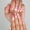 Close-up of Naillover Whisper of Wisteria 3D floral nails, showing butterfly and flower details on blush gradient base.