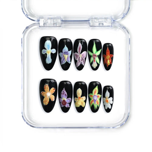 Night Petals almond press-on nails featuring black bases and iris flower art, handmade in Singapore by Naillover.