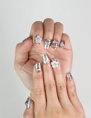 Close-up of Nightfall Singapore press on nails, metallic silver with rhinestones, elegant handmade design by naillover.