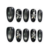 Product display of Naillover’s black oval press-on nail set with ombré shimmer and butterfly charms