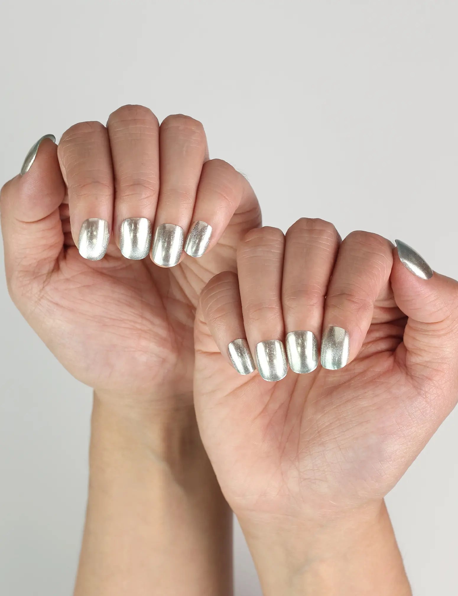 Ocean Breeze Singapore press on nails in blue shimmer, worn for a fresh summer-inspired manicure.