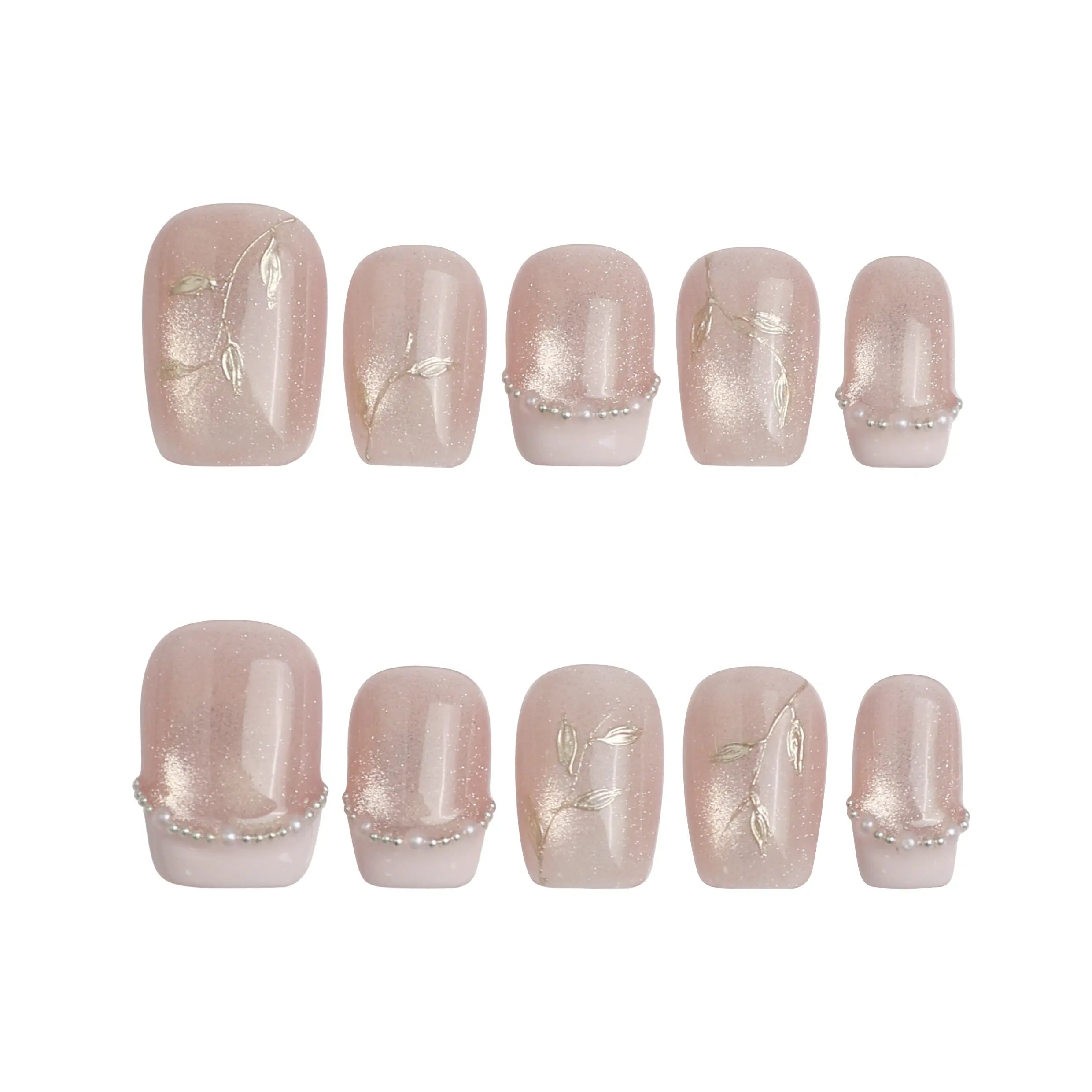 Product display of short peach pink press on nails with refined gold lines and a gentle glitter effect, crafted by Naillover in Singapore