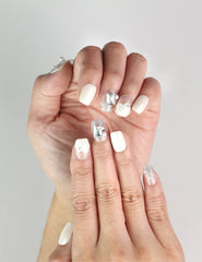 Close-up of Pearl Sparkle white press-on nails with pearl and gemstone accents, handmade Singapore nails by naillover