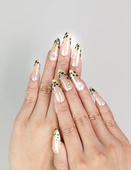 Model wearing Pearly Blossom Singapore press on nails with leopard print and floral designs, handmade by naillover