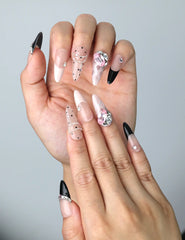 Close-up of Naillover’s handmade Singapore nails featuring a blend of pastel pink and animal print graphics