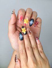 Close-up of Naillover’s handmade Singapore nails featuring wild animal print paired with delicate 3D floral art