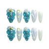 Product display of Naillover’s handmade blue press-on nail set with 3D seashells and gold starfish