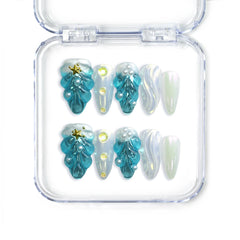 Handmade blue almond press on nails with 3D shell textures and gold starfish, from Singapore brand Naillover