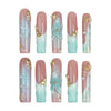 Product flat lay of Singapore handmade long pipe press on nails featuring 3D ocean waves, flowers, and gold starfish by Naillover
