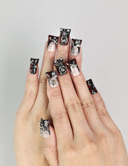 Model wearing Shadow Forge Y2K metallic Singapore press on nails with silver shimmer accents by naillover