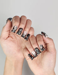 Hand posed to show Shadow Forge Y2K metallic Singapore press on nails with trendy silver design by naillover