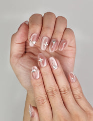 Close-up of Naillover Silver Charm Singapore press on nails, showing glossy cat eye shimmer and silver butterfly details.