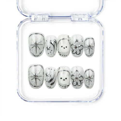 Naillover Silver Starry Cutie handmade press on nails with galaxy-inspired base, bunny, cartoon flower, shimmering stars, and playful cute nail design.