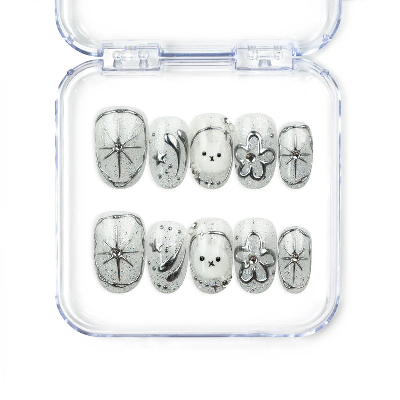 Naillover Silver Starry Cutie handmade press on nails with galaxy-inspired base, bunny, cartoon flower, shimmering stars, and playful cute nail design.