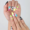 Colorful press-on nails in short almond shape with cheerful emoji designs and glossy finish