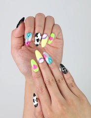 Colorful press-on nails in short almond shape with cheerful emoji designs and glossy finish
