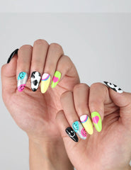 Close-up of multicolored smiley face nail art with 3D hearts, perfect for a fun summer manicure