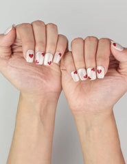 naillover Sparkle Love press on nails on hand, featuring dazzling white sparkle with red heart details, elegant yet playful cute nails.