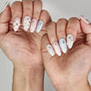 Naillover Starry Sweet Dream cute nails styled on hand, showing dreamy ombre colors with pearl and star embellishments.