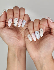Naillover Starry Sweet Dream cute nails styled on hand, showing dreamy ombre colors with pearl and star embellishments.