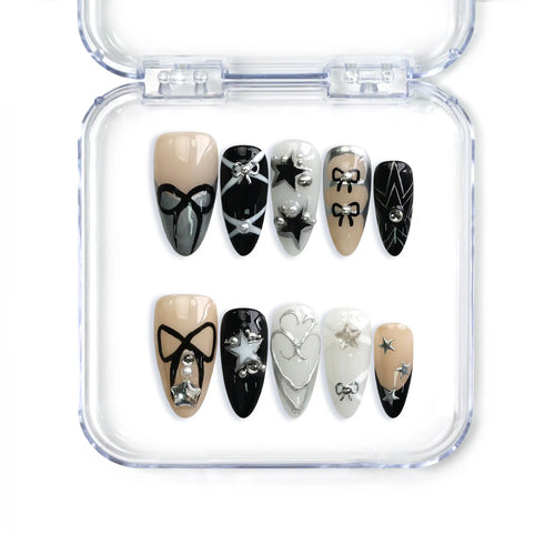 Naillover handmade almond press on nails in nude and black with stars and bows, Singapore design