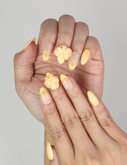 Close-up of Naillover Sunny Bloom Singapore press on nails showing delicate floral and pearl 3D accents.