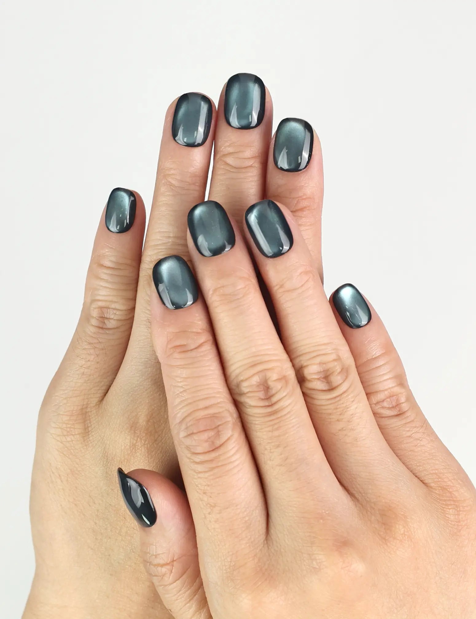 Hand model wearing Teal Gleam handmade Singapore press on nails with teal iridescent shine, trendy nails look by naillover