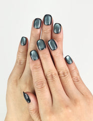 Hand model wearing Teal Gleam handmade Singapore press on nails with teal iridescent shine, trendy nails look by naillover