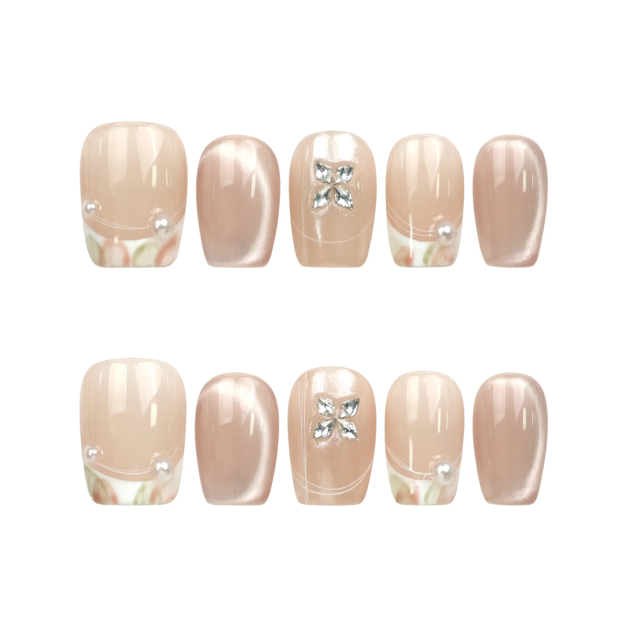 Flat lay of Naillover Whisper Beige Singapore press on nails set, featuring handmade gradient nails with delicate silver gemstone accent.