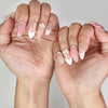 Naillover Whispering Petals in Pink Haze trendy nails styled on hand, featuring neutral base with sculpted blossoms.