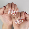 Festive Xmas Sparkle red and white handmade press-on nails with bows, Singapore press-on nails by naillover