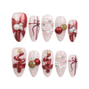 Xmas Sparkle red and white handmade press-on nails with festive bows on white background, Singapore press on nails by naillover