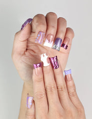 Side view of hand with Y2K Purple Haze Singapore press on nails by naillover, featuring Y2K-inspired linear purple designs.