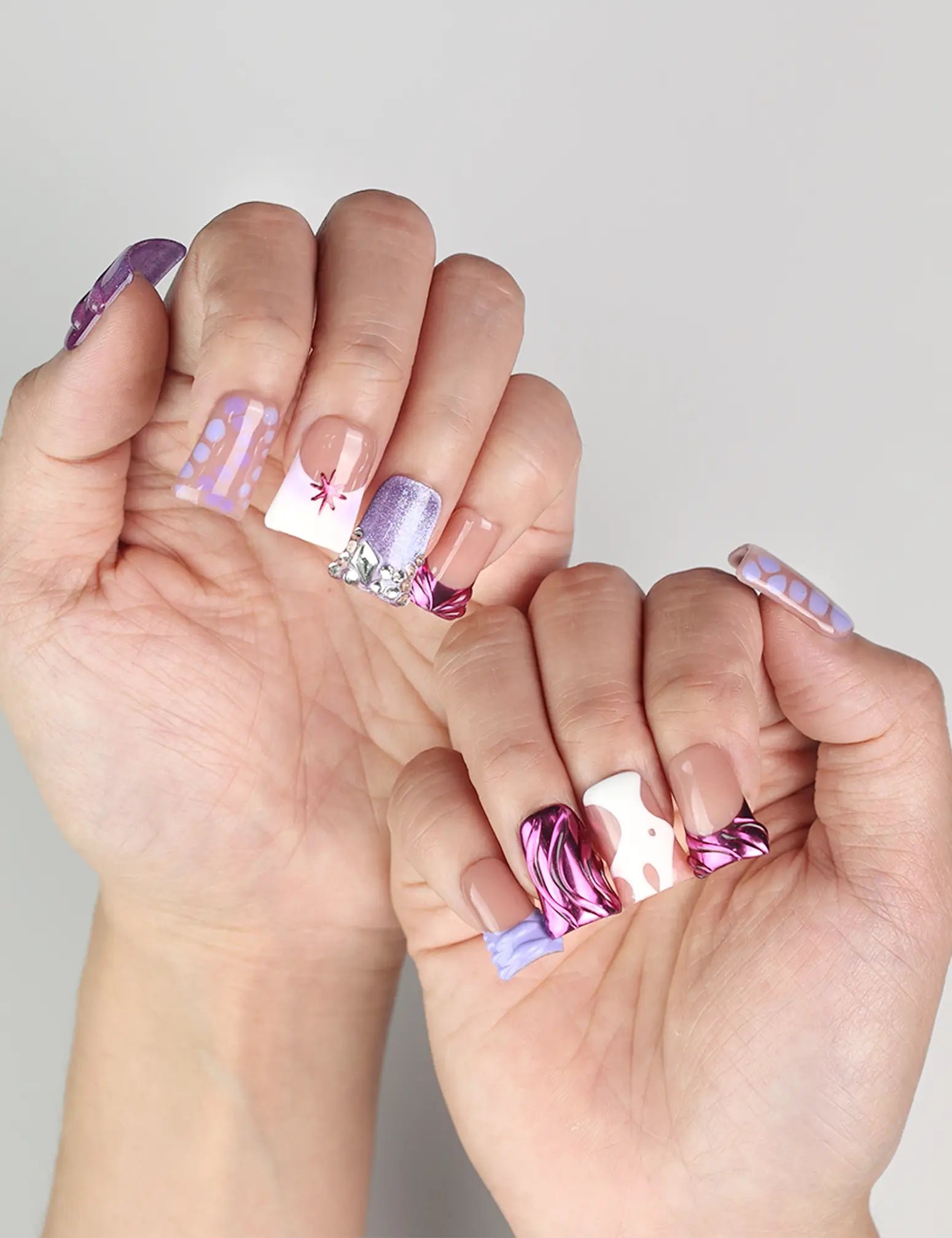 Close-up of Y2K Purple Haze handmade press on nails on model’s hand, highlighting bold purple hues and trendy Y2K nail art.
